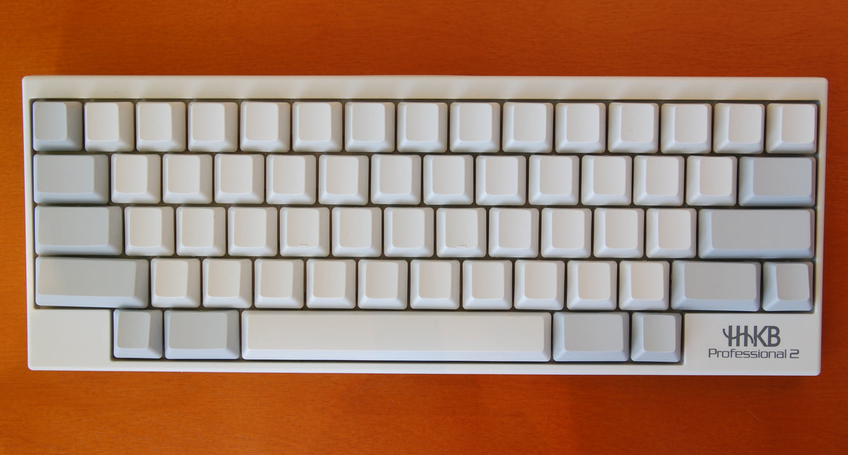 A white Happy Hacking Keyboard Professional 2 with blank keycaps
