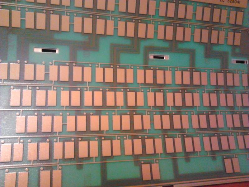 An opened IBM Model F assembly showing the capacitive pads