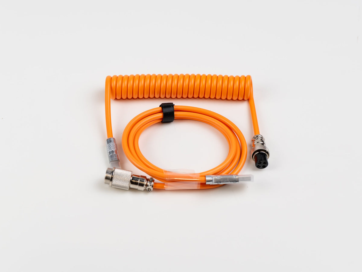 Orange coiled USB-C aviator cable, full view