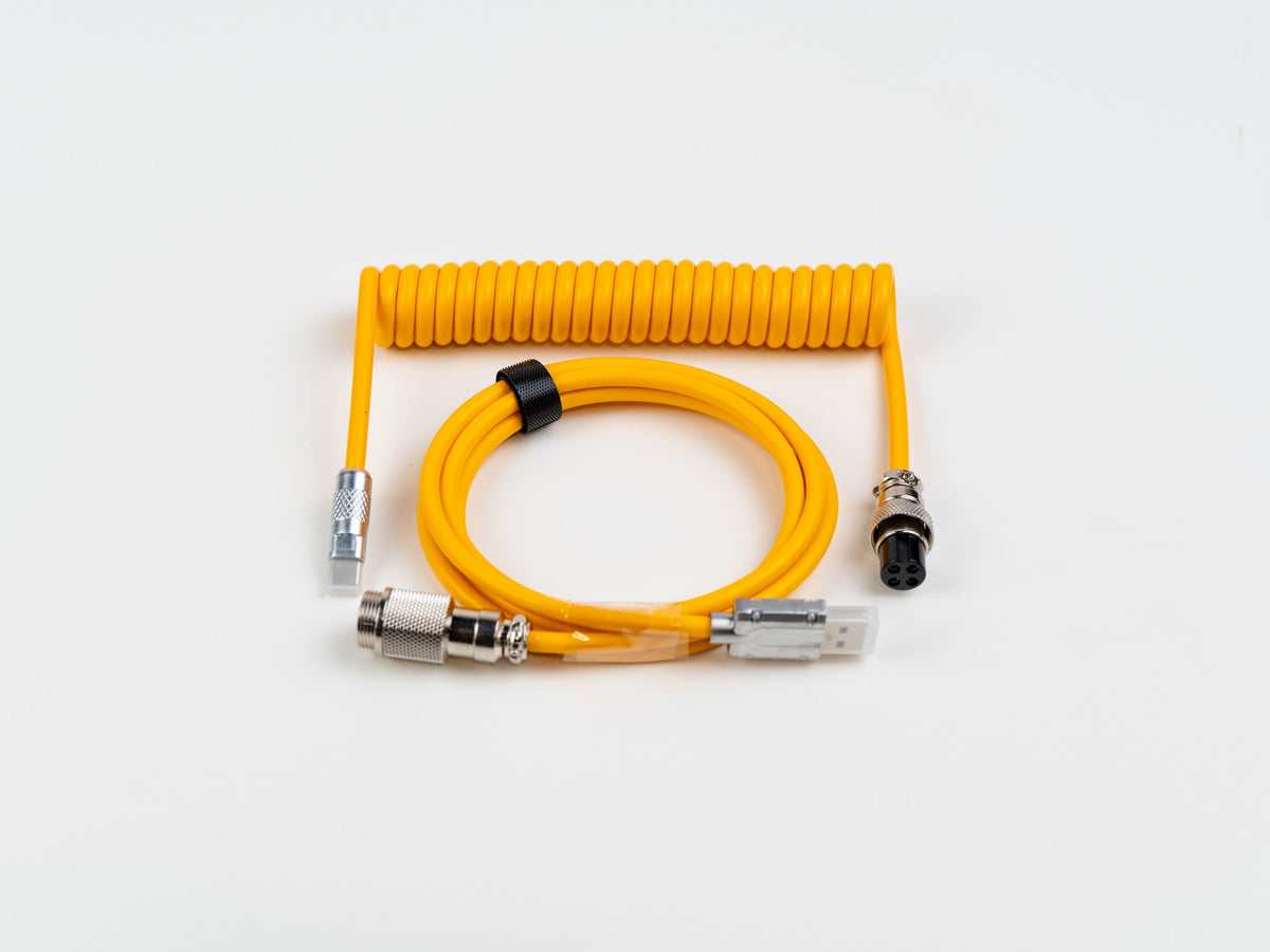 Yellow coiled USB-C aviator cable, full view