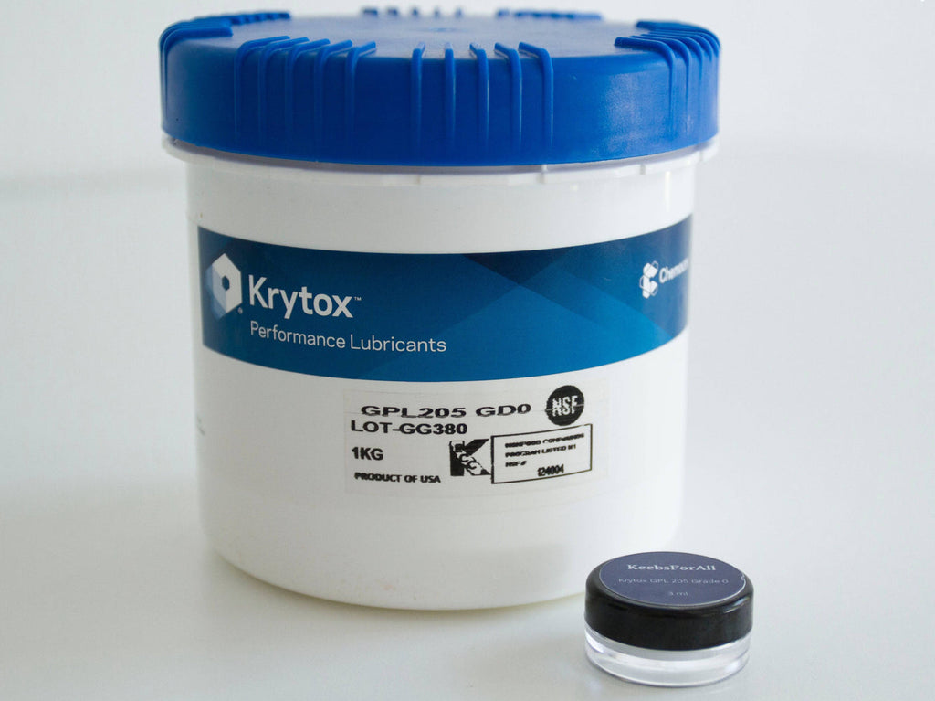 Krytox 205G0 1KG manufacturer tub next to 3mL jar
