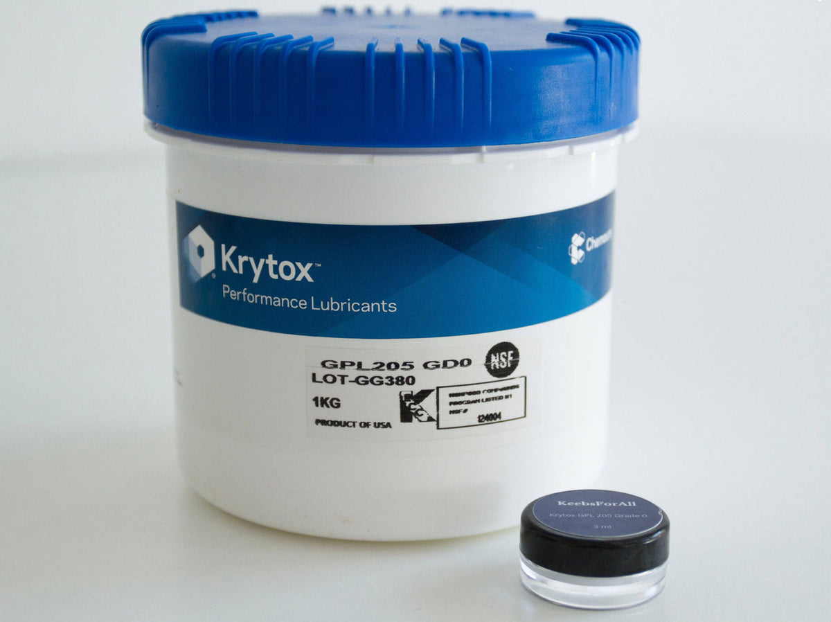 Krytox 205G0 1KG manufacturer tub next to 3mL jar