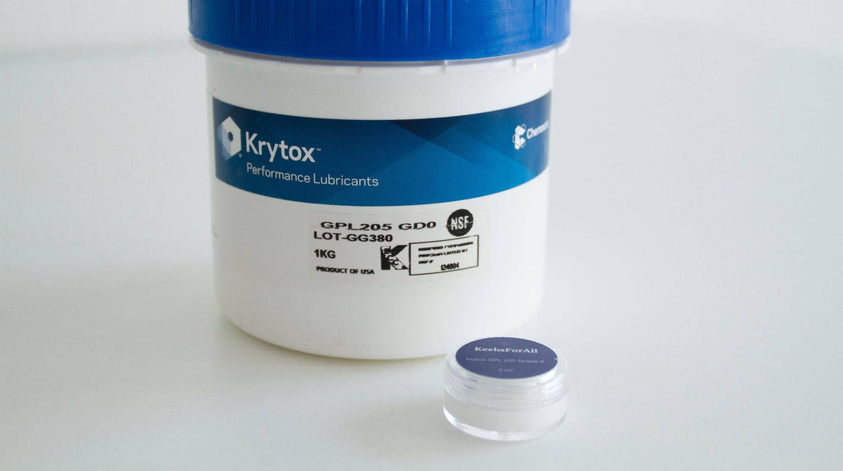 Krytox 205G0 1KG manufacturer tub next to 5mL jar
