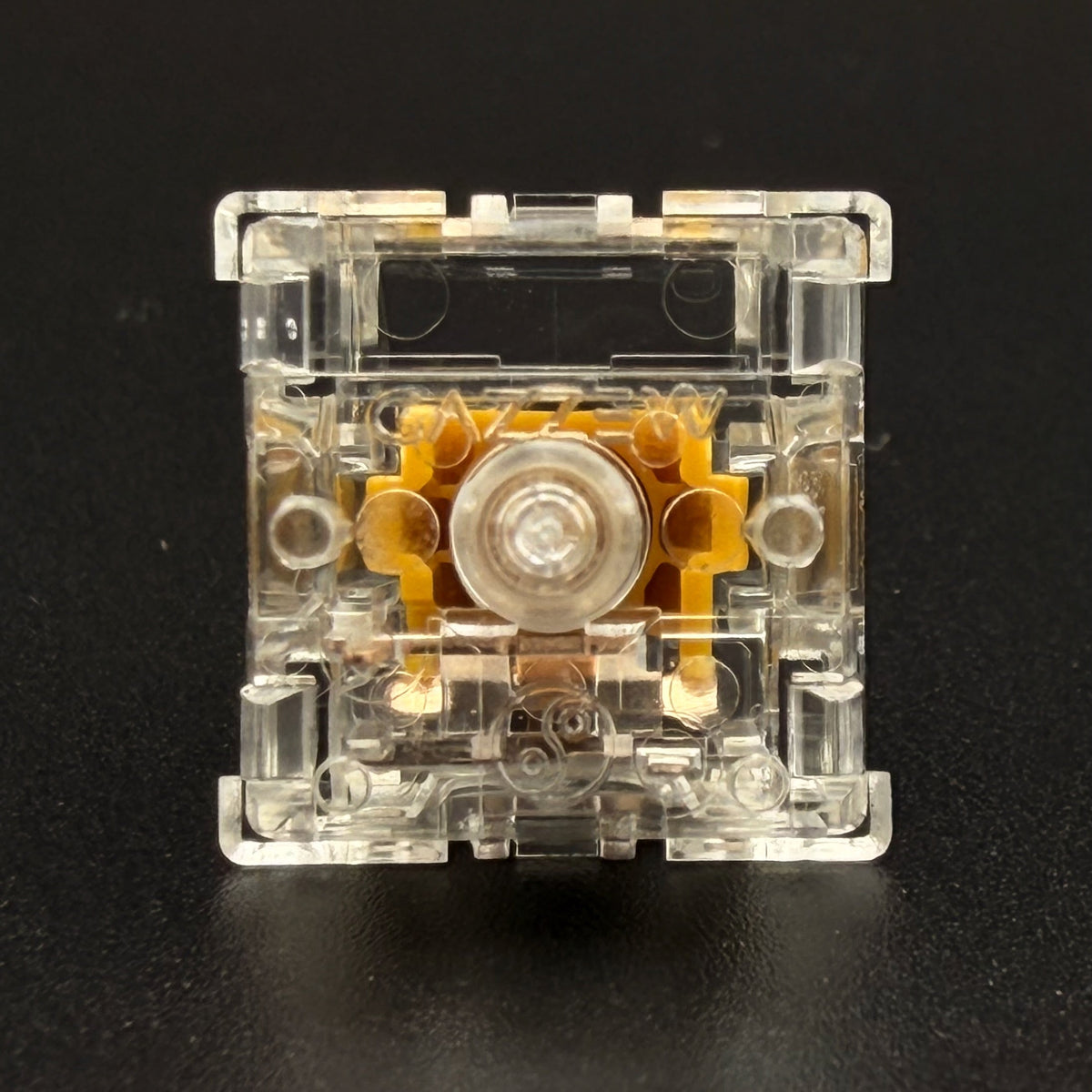 Underside view of Gazzew Boba U4T tactile switch, showing pins and GAZZEW embossed housing